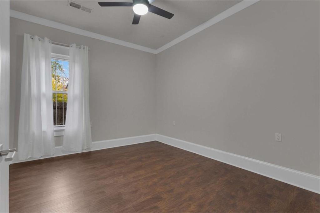 1286 Allene Avenue Southwest Atlanta, GA 30310 - Photo 31 of 49 wooden floor in an empty room with a window