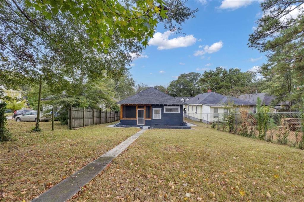 1286 Allene Avenue Southwest Atlanta, GA 30310 - Photo 48 of 49 a house with trees in the background