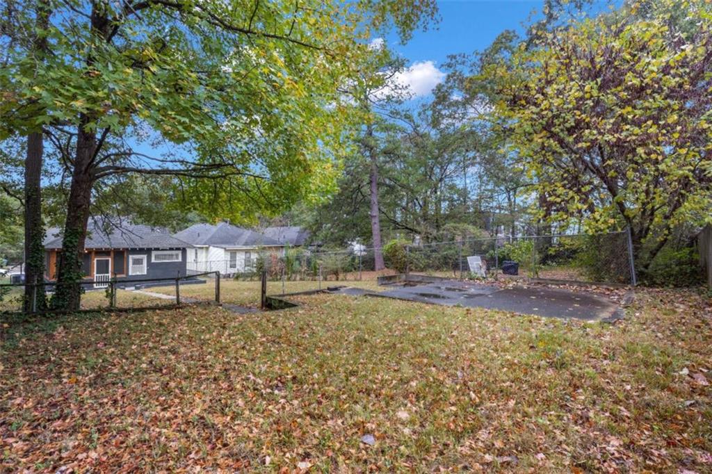 1286 Allene Avenue Southwest Atlanta, GA 30310 - Photo 49 of 49 a house with trees in the background