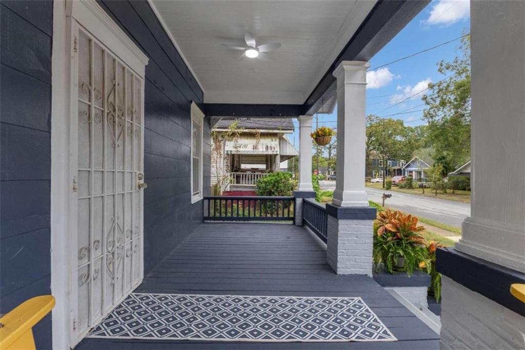 1286 Allene Avenue Southwest Atlanta, GA 30310 - Photo 6 of 49 a view of a room with wooden floor and iron stairs