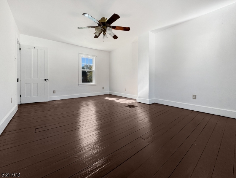 54 Front Street Belvidere, NJ 07823 - Photo 15 of 32 an empty room with wooden floor and windows