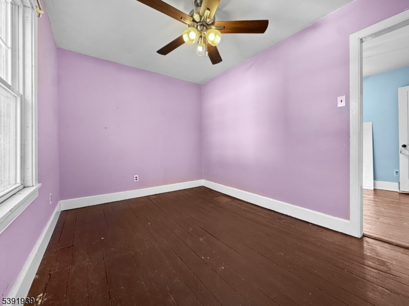 54 Front Street Belvidere, NJ 07823 - Photo 16 of 32 an empty room with a window and a fan