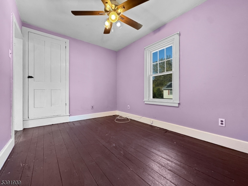 54 Front Street Belvidere, NJ 07823 - Photo 17 of 32 a view of an empty room with wooden floor and a window