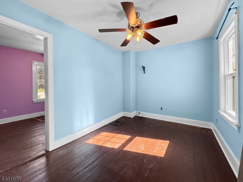 54 Front Street Belvidere, NJ 07823 - Photo 18 of 32 an empty room with wooden floor and windows