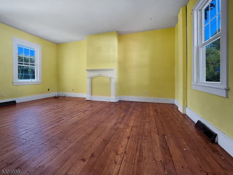 54 Front Street Belvidere, NJ 07823 - Photo 2 of 32 a view of empty room with wooden floor and fan