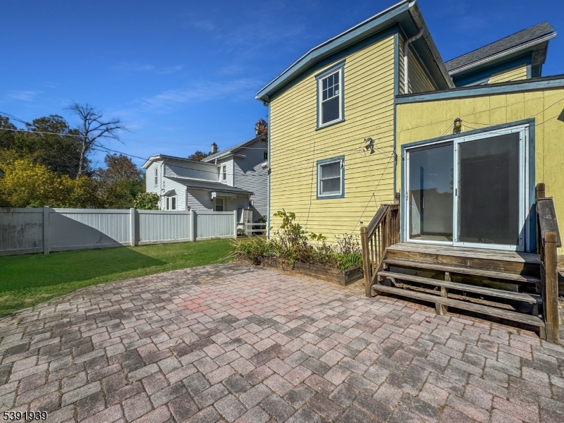 54 Front Street Belvidere, NJ 07823 - Photo 26 of 32 a yellow house with trees in front of it
