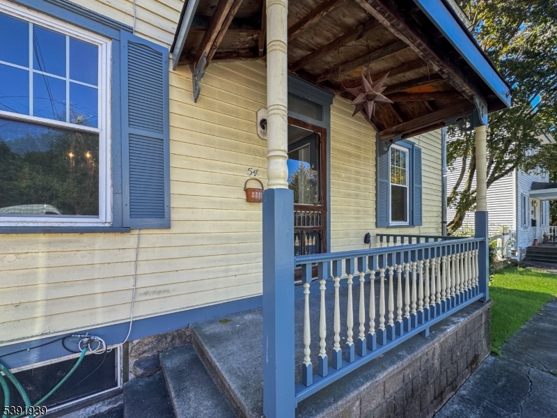 54 Front Street Belvidere, NJ 07823 - Photo 31 of 32 a view of a house with a small deck and wooden floor