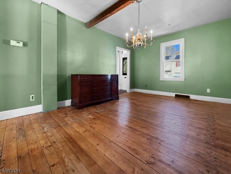 54 Front Street Belvidere, NJ 07823 - Photo 5 of 32 a view of a room with wooden floor and chandelier