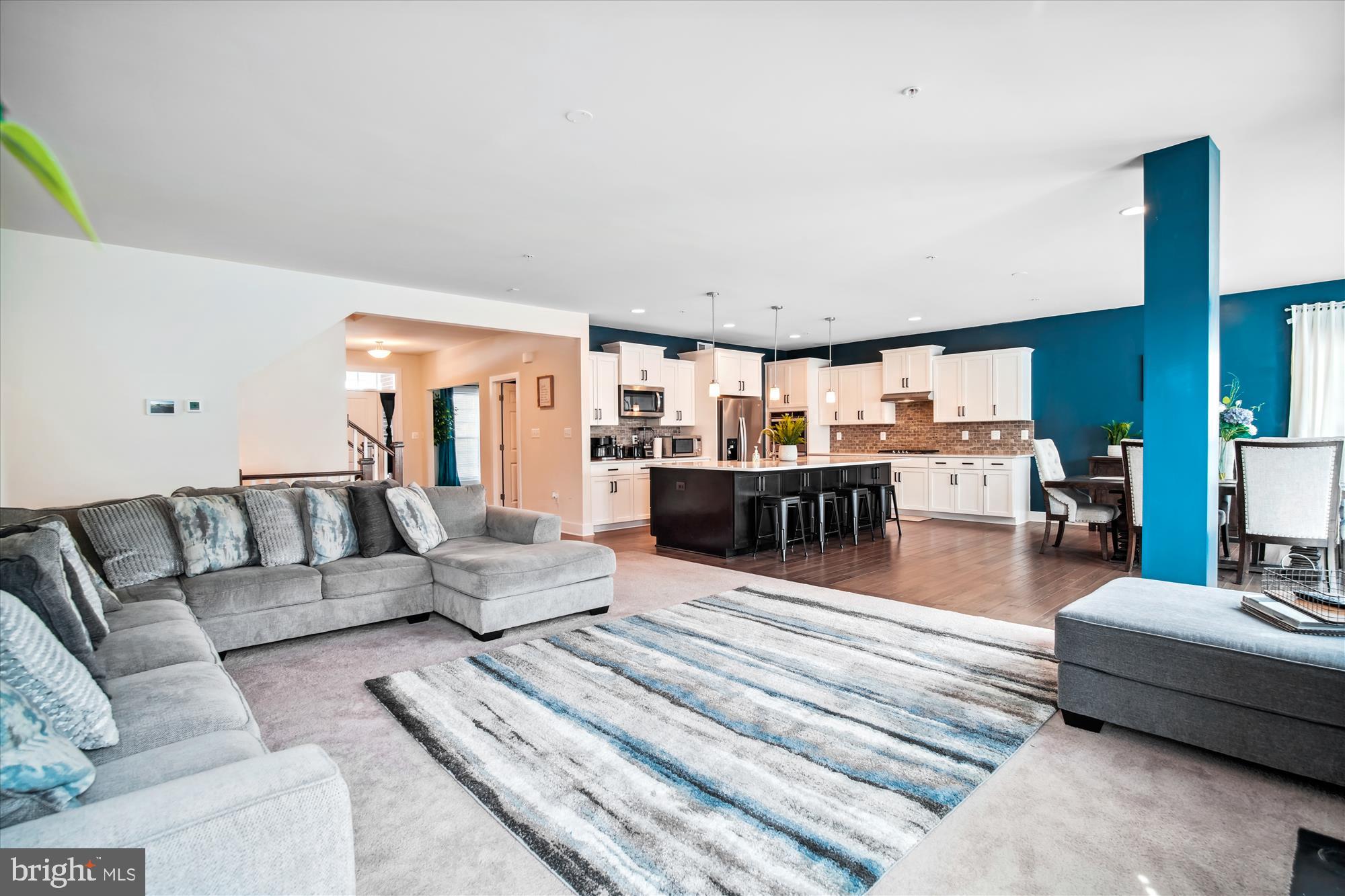 12600 Abercorn Place Brandywine, MD 20613 - Photo 16 of 43 a living room with furniture and view of kitchen