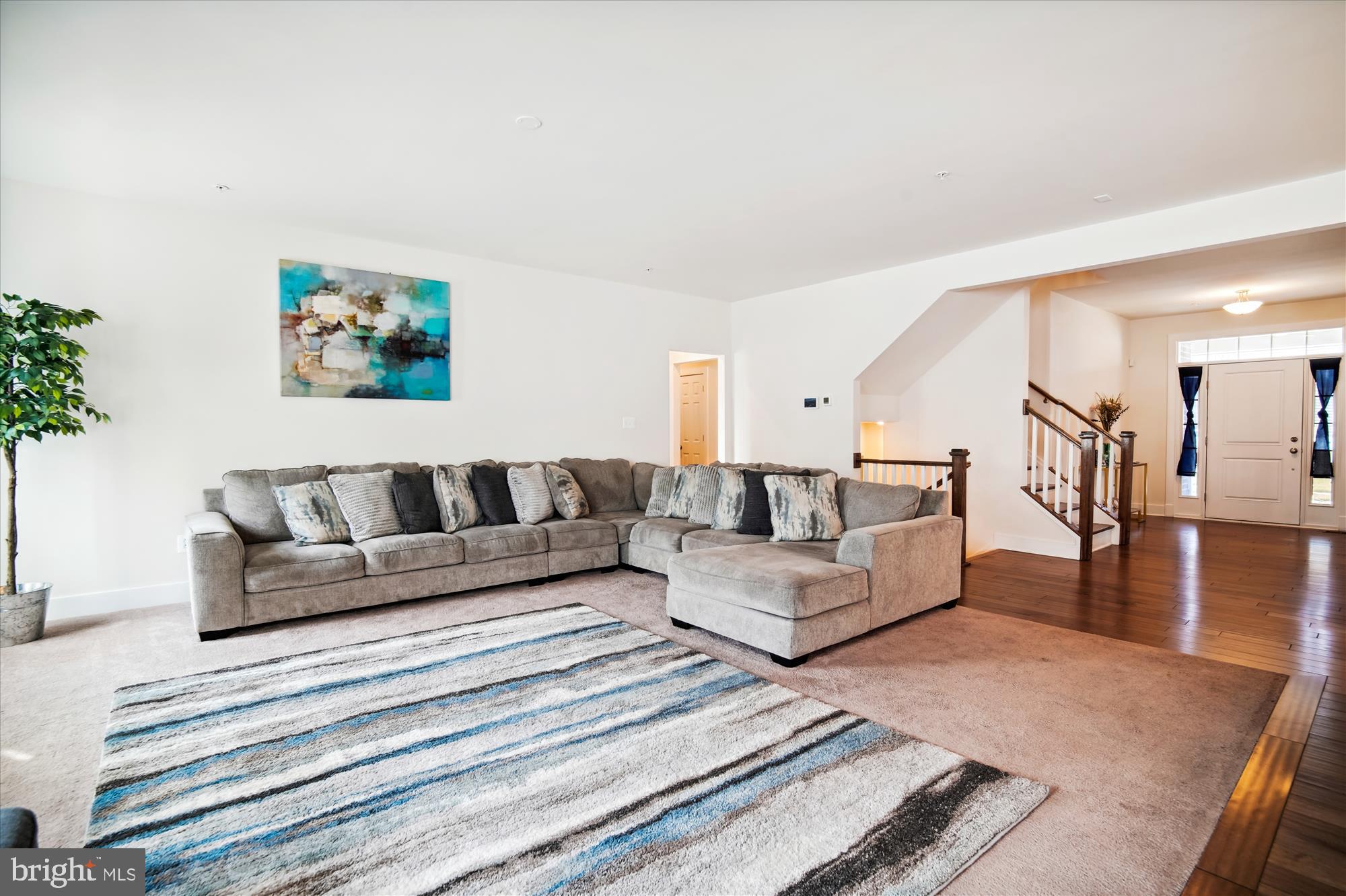 12600 Abercorn Place Brandywine, MD 20613 - Photo 17 of 43 a living room with furniture and a view of kitchen