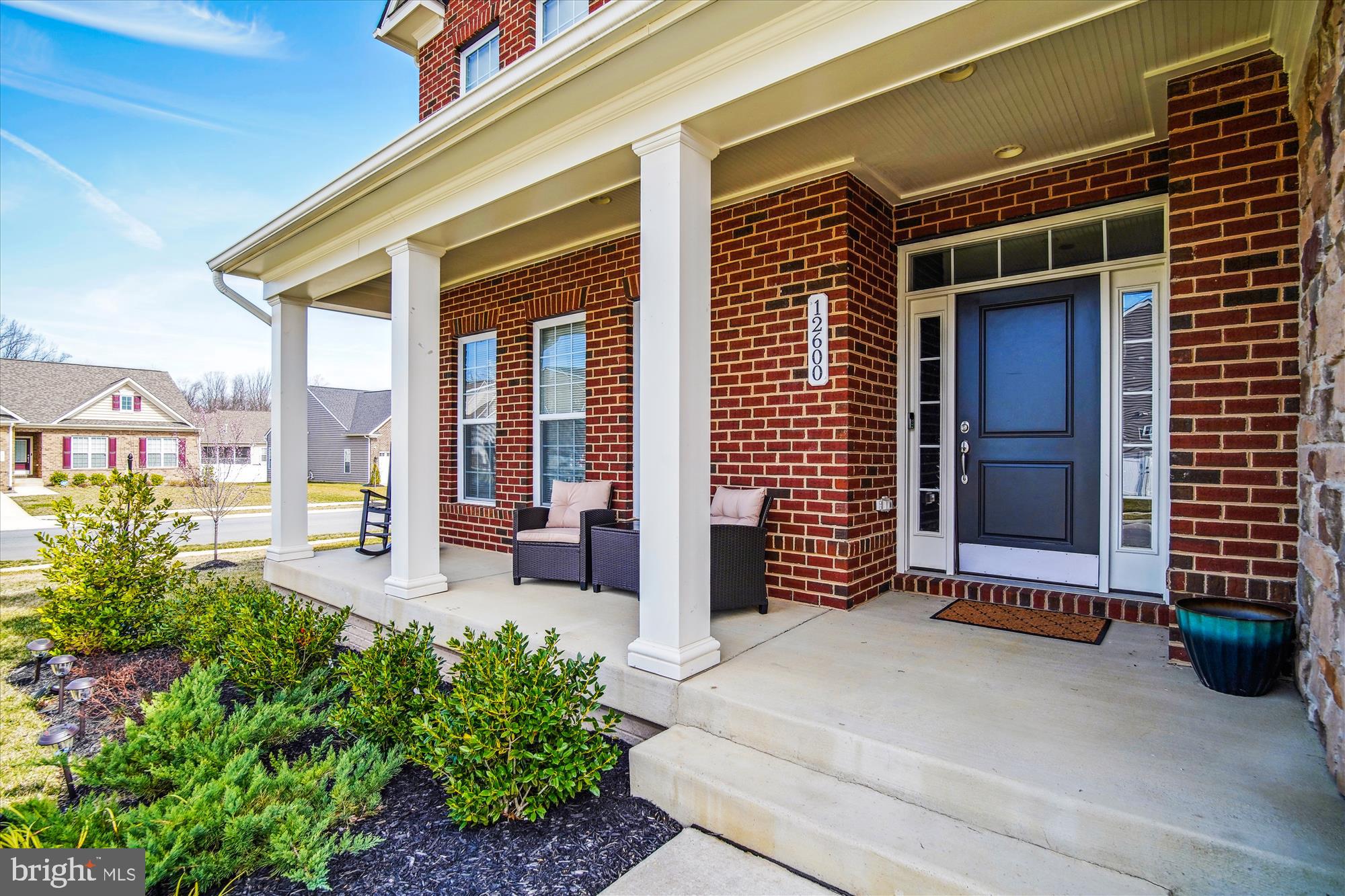 12600 Abercorn Place Brandywine, MD 20613 - Photo 2 of 43 a front view of a house with a porch