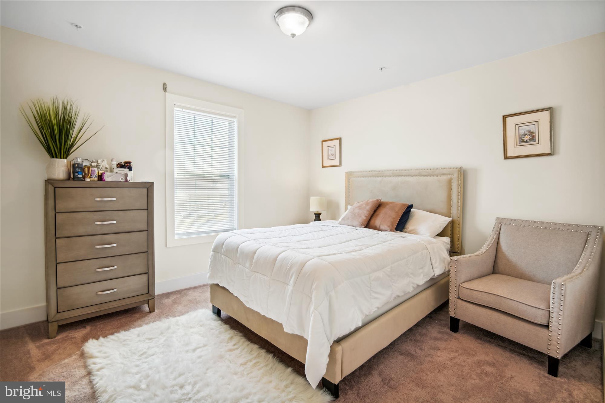 12600 Abercorn Place Brandywine, MD 20613 - Photo 29 of 43 a bedroom with a bed and a couch