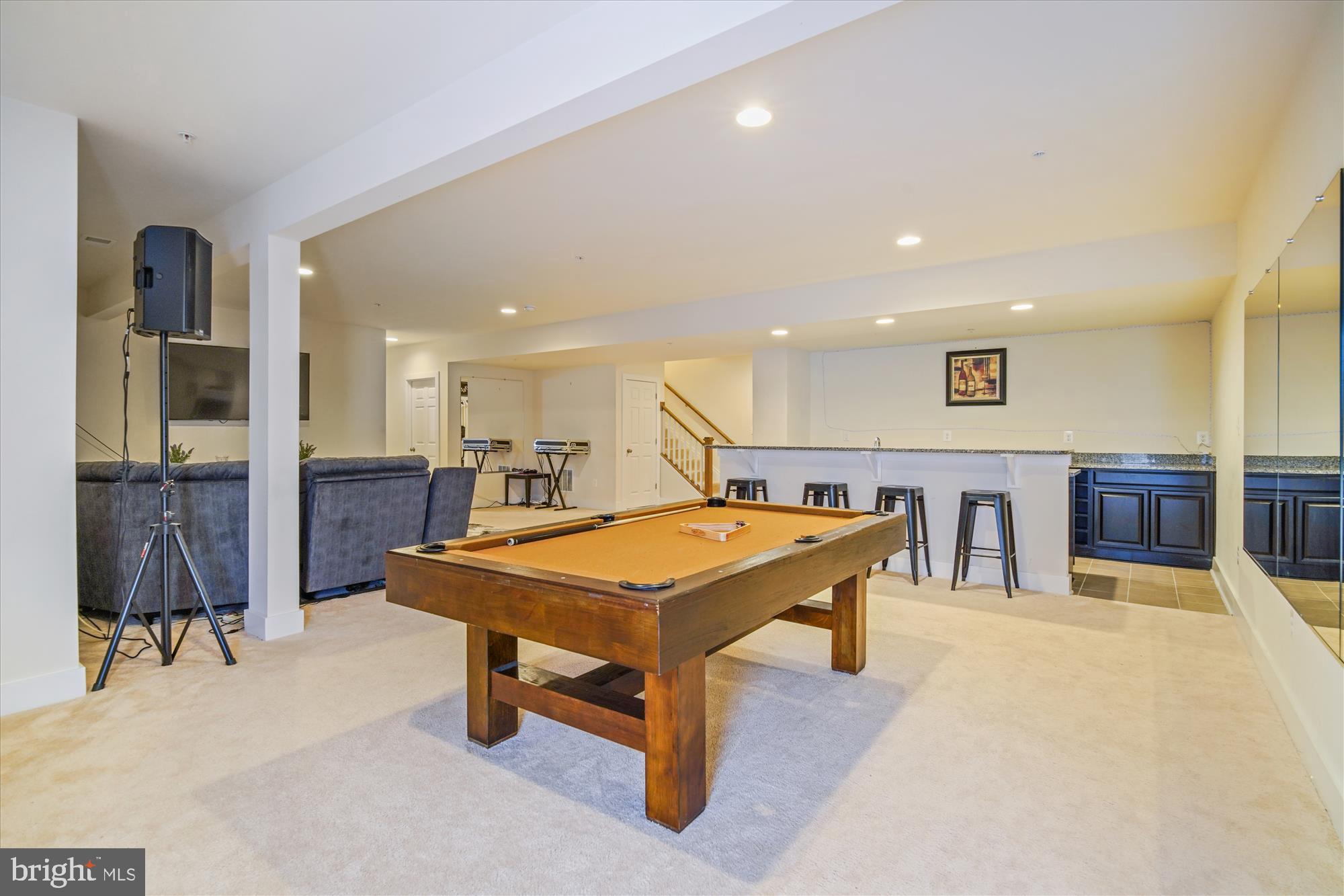 12600 Abercorn Place Brandywine, MD 20613 - Photo 36 of 43 a living room with stainless steel appliances lots of furniture and kitchen view