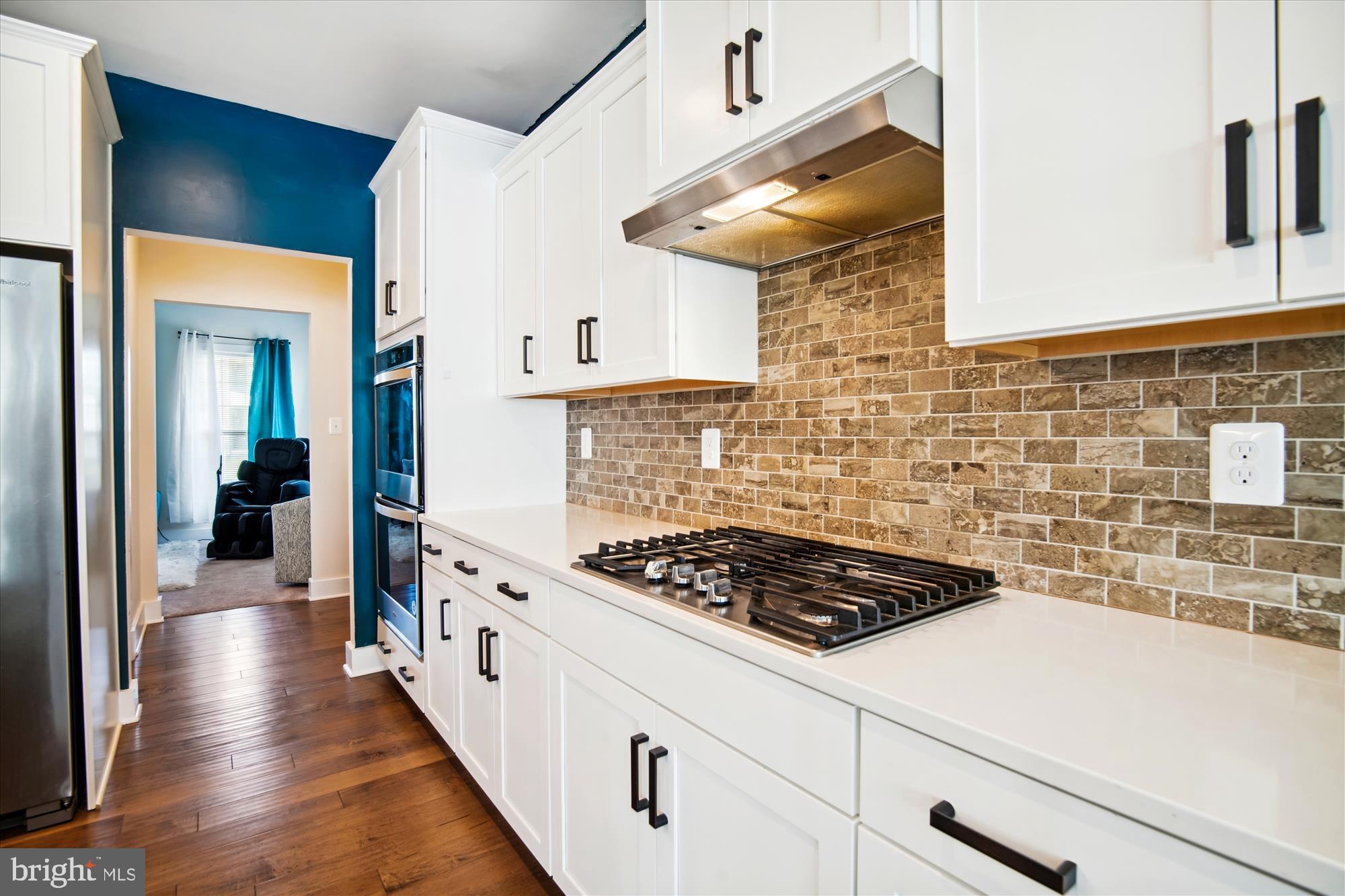 12600 Abercorn Place Brandywine, MD 20613 - Photo 9 of 43 a kitchen with stainless steel appliances a stove a sink and a refrigerator