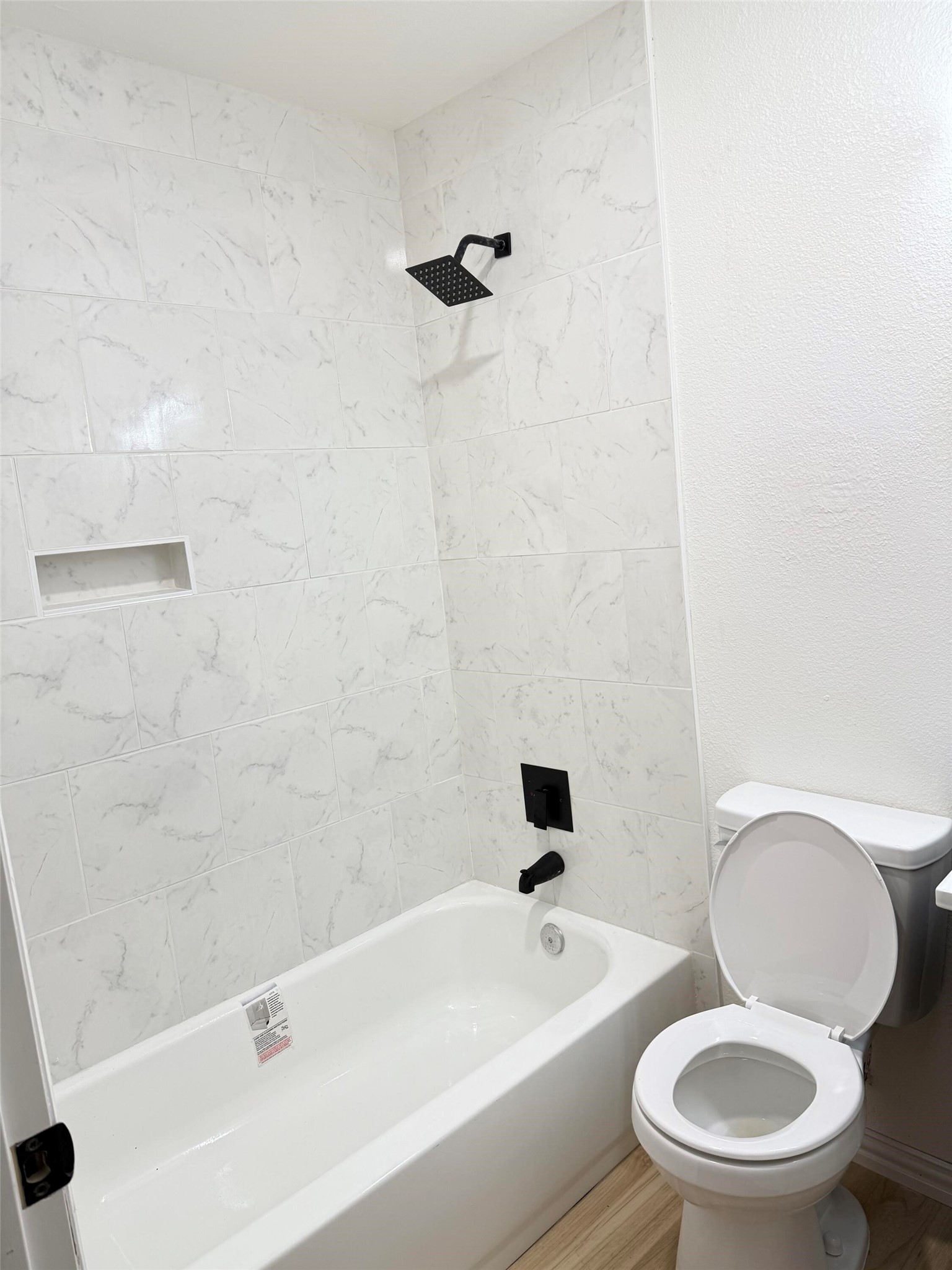 12939 Segrest Drive Houston, TX 77047 - Photo 12 of 12 a white toilet and a shower