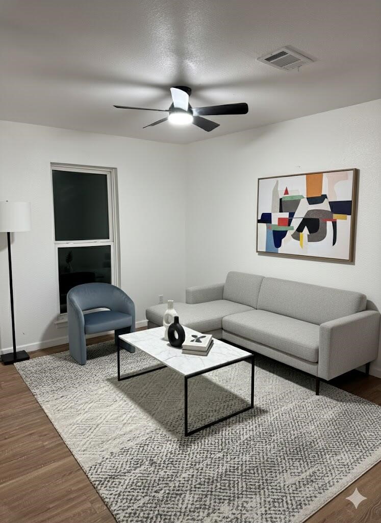 12939 Segrest Drive Houston, TX 77047 - Photo 5 of 12 a living room with furniture and a rug