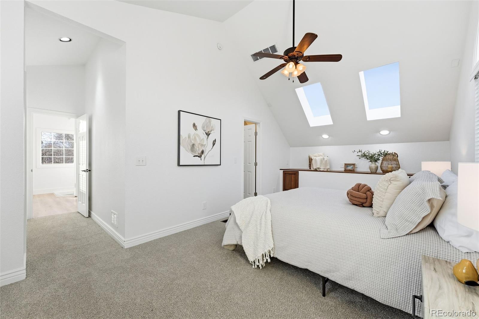 1661 Trenton Street Denver, CO 80220 - Photo 23 of 50 a bedroom with a bed and window