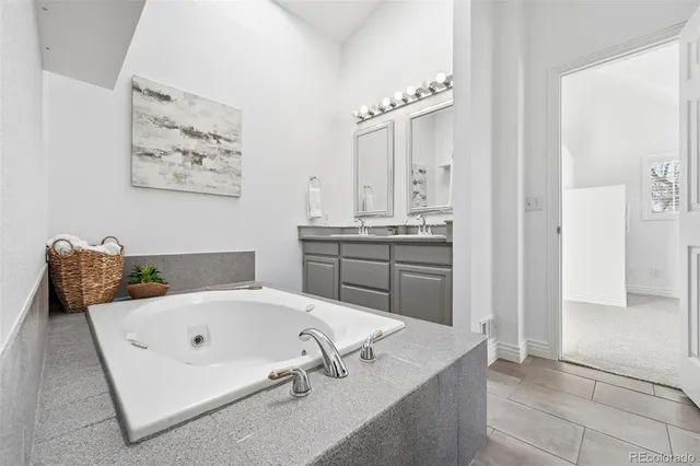 a en suite bathroom with a bathtub and window