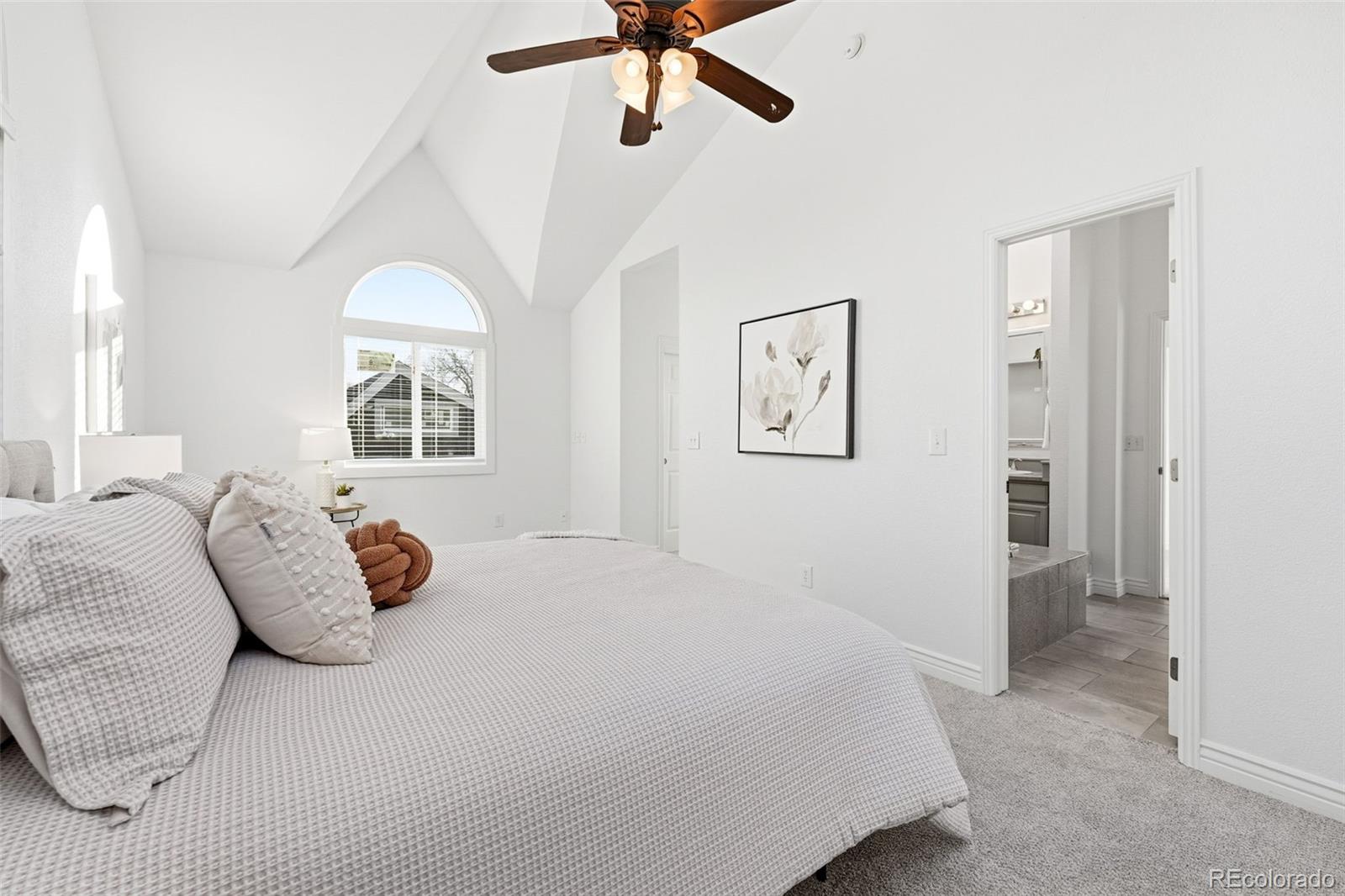 1661 Trenton Street Denver, CO 80220 - Photo 25 of 50 a bedroom with a large bed and a window