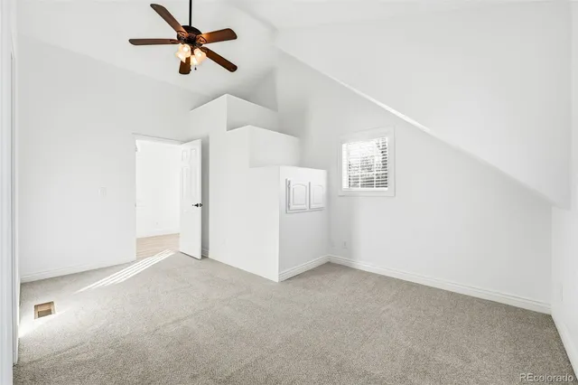 a view of an empty room and a window