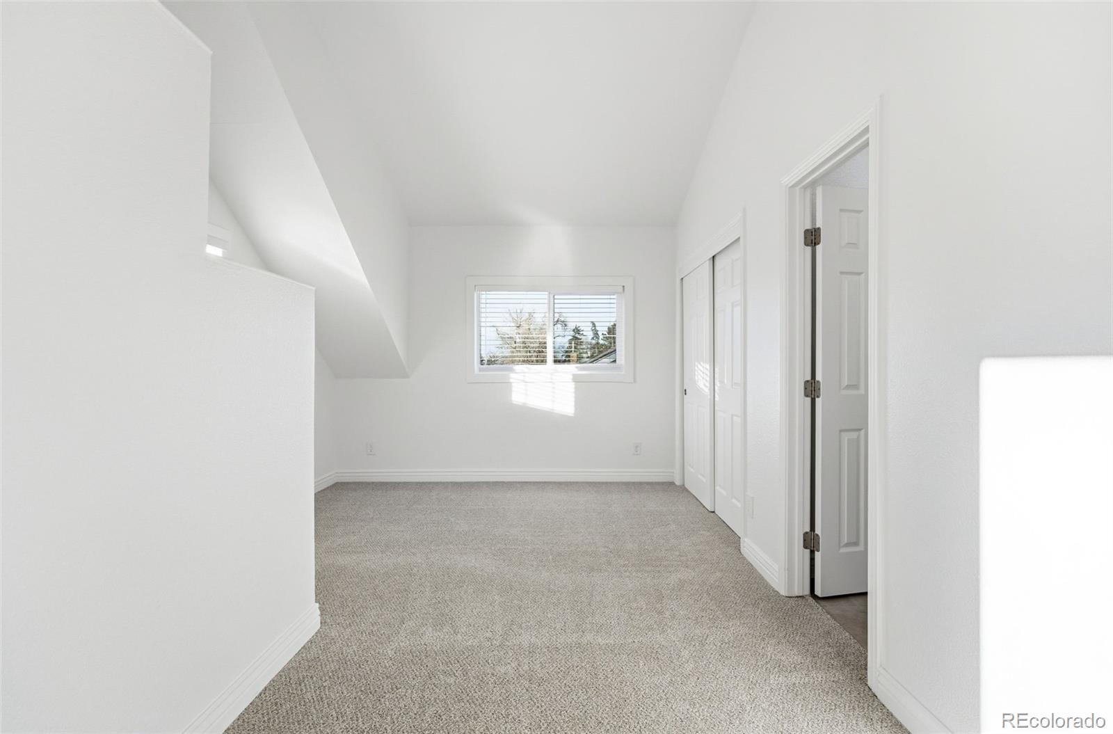 1661 Trenton Street Denver, CO 80220 - Photo 30 of 50 a view of an empty room and a window