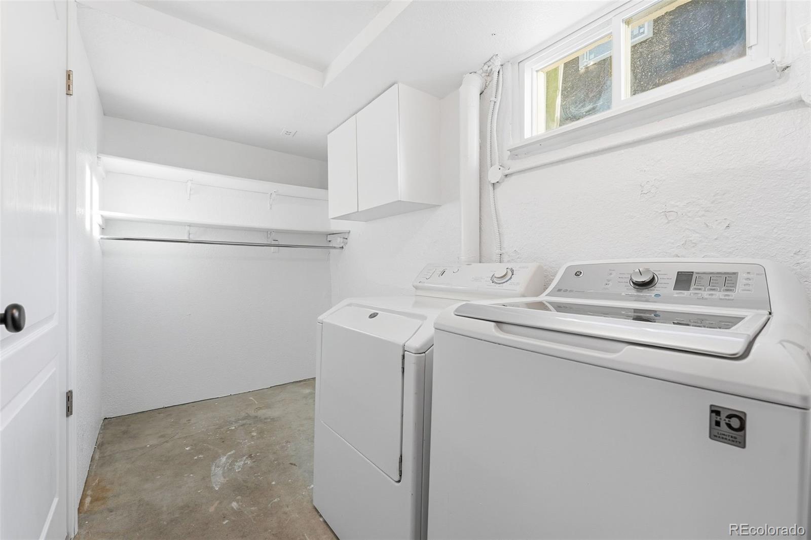 1661 Trenton Street Denver, CO 80220 - Photo 37 of 50 a utility room with dryer and washer