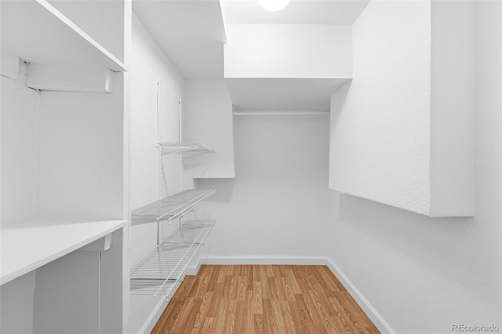 1661 Trenton Street Denver, CO 80220 - Photo 38 of 50 a view of a room with wooden floor