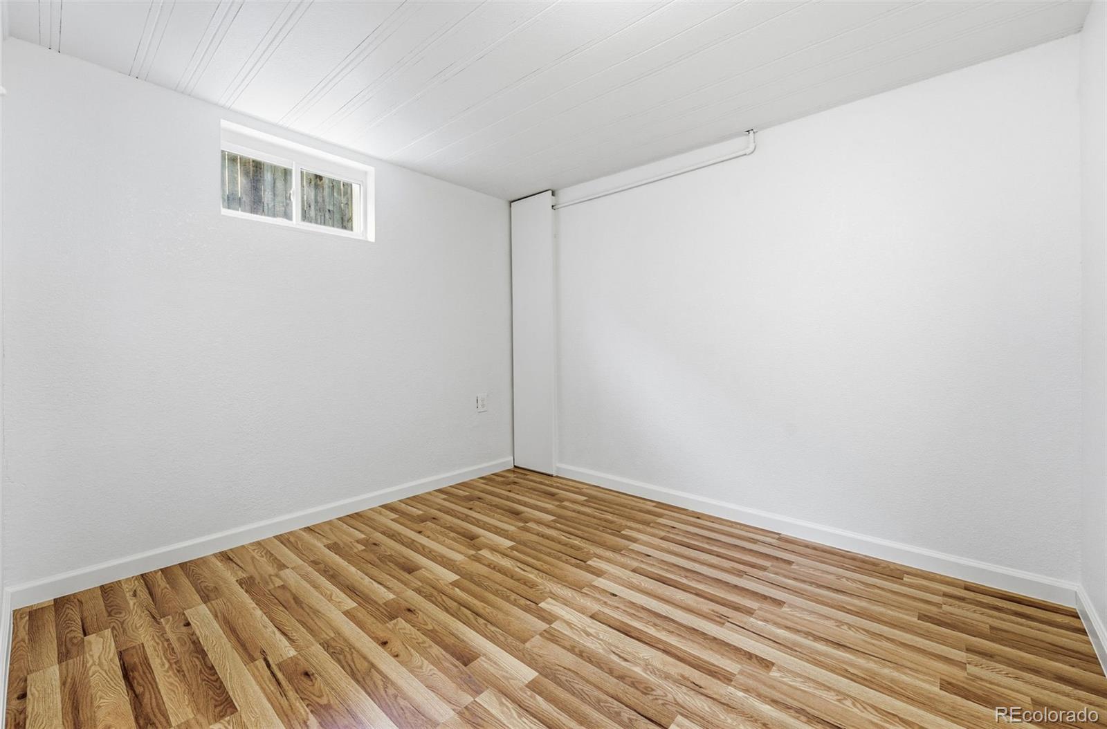 1661 Trenton Street Denver, CO 80220 - Photo 40 of 50 a view of a room with wooden floor