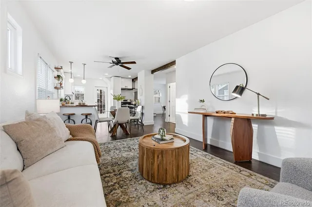 a living room with furniture a window and a sink