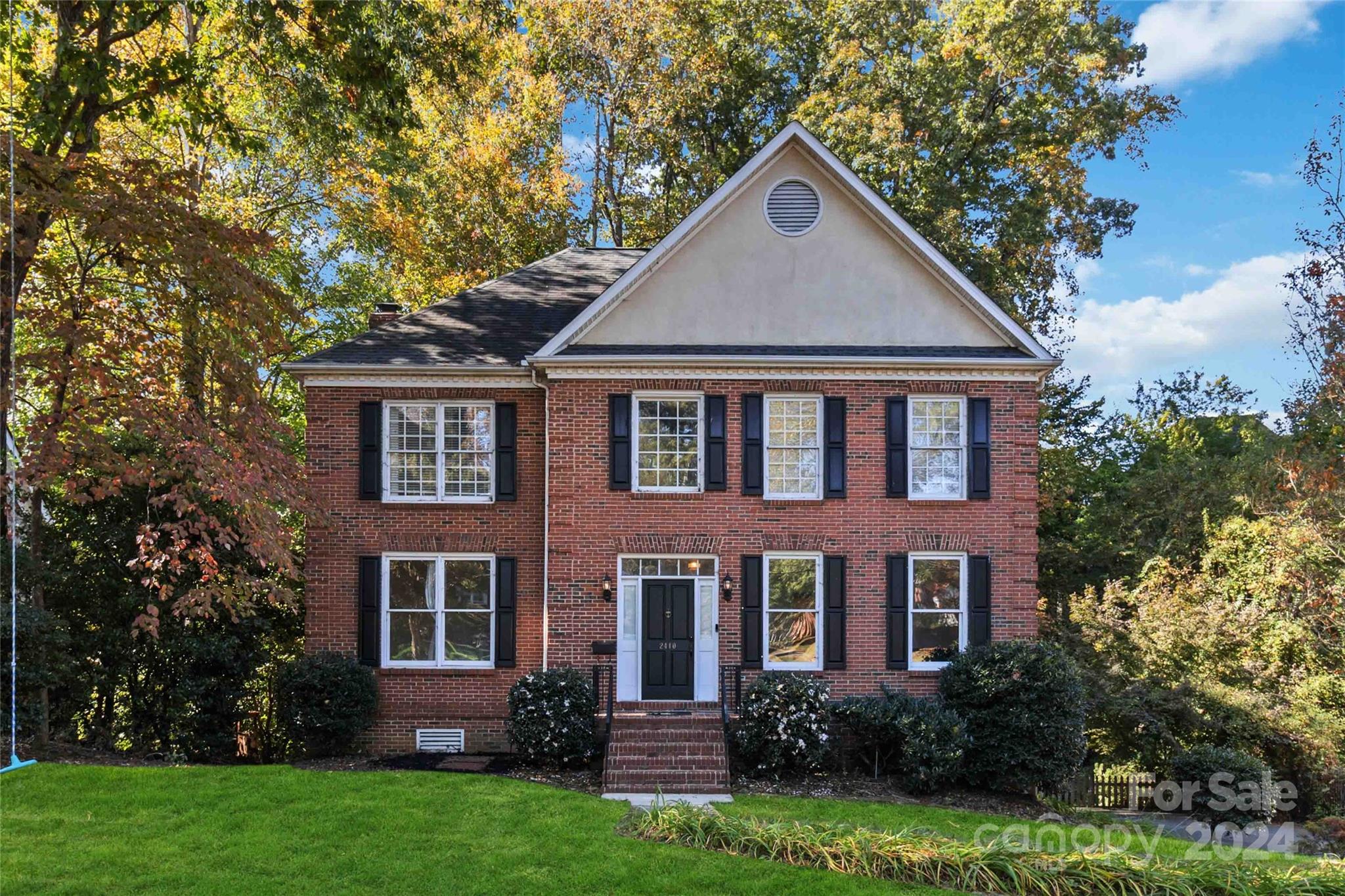 front view of a house with a yard