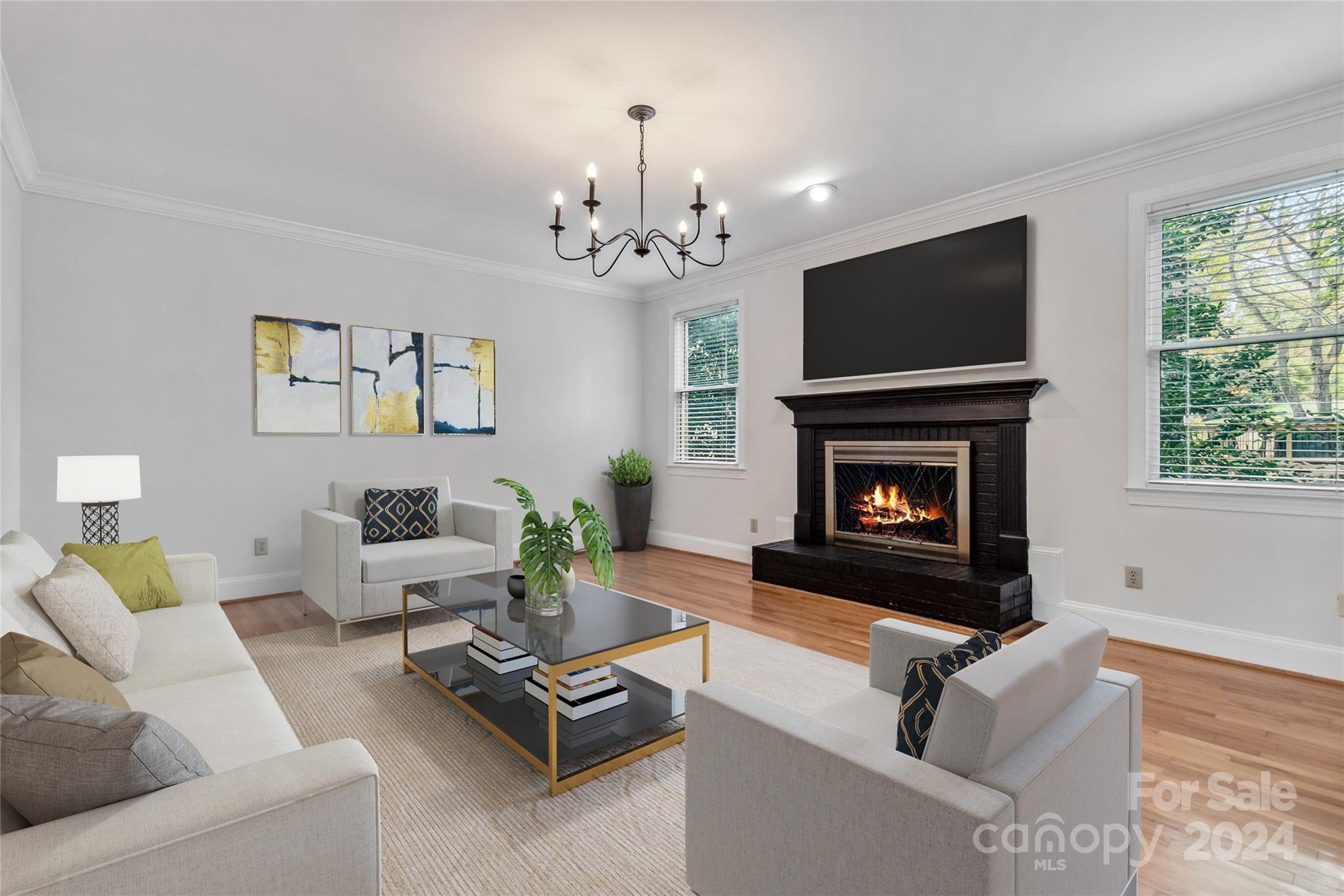 2410 Sharon Road Charlotte, NC 28211 - Photo 14 of 32 a living room with furniture a flat screen tv and a fireplace
