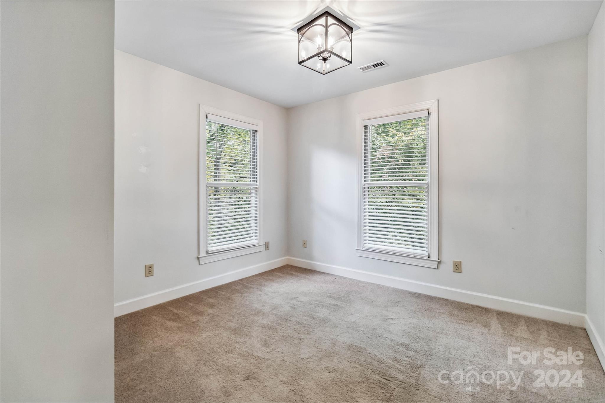 2410 Sharon Road Charlotte, NC 28211 - Photo 18 of 32 a view of an empty room with a window