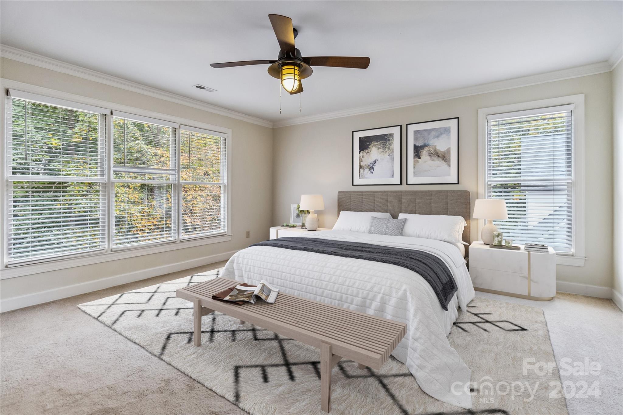 2410 Sharon Road Charlotte, NC 28211 - Photo 21 of 32 a bedroom with a bed and a large window