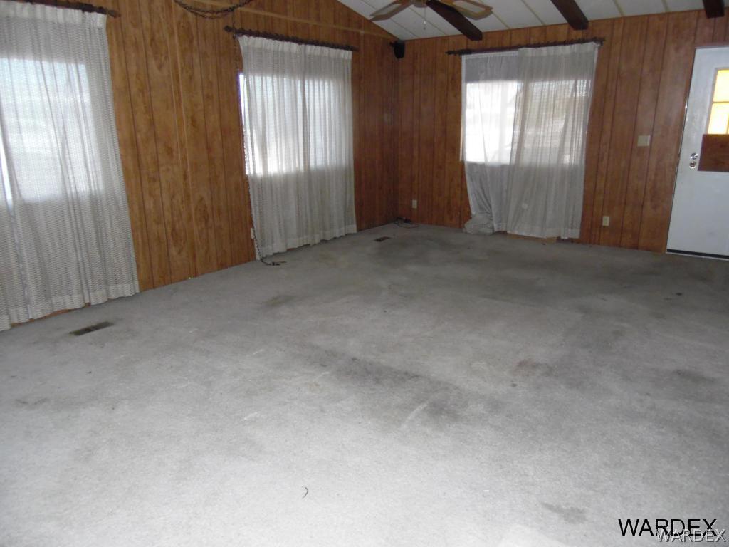5654 Pasadena Road Fort Mohave, AZ 86426 - Photo 4 of 17 an empty room with windows