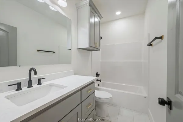 a view of a livingroom with a chandelier fan