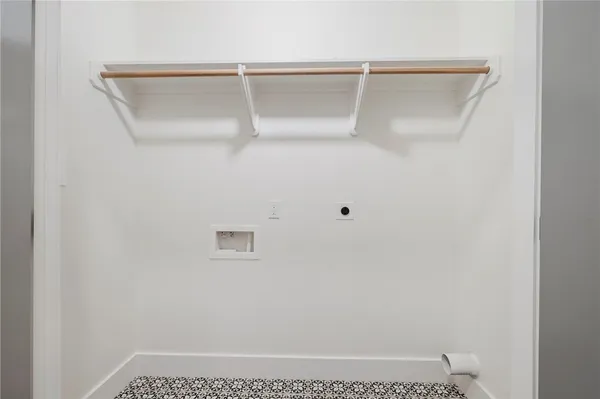 a front view of house with yard and trees in the background