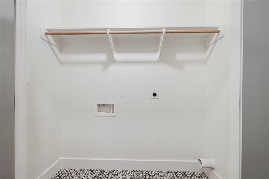 203 Lock Lane Bryan, TX 77803 - Photo 20 of 22 a view of small space with racks on the wall