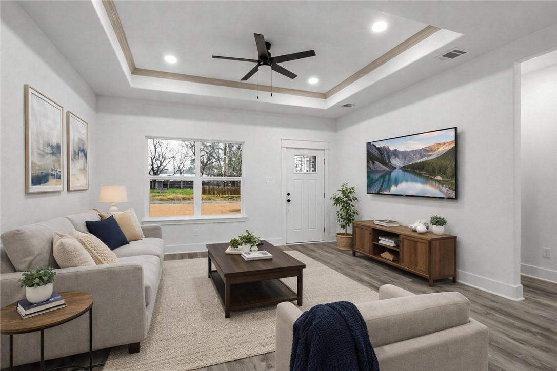 203 Lock Lane Bryan, TX 77803 - Photo 5 of 22 a living room with furniture and a flat screen tv