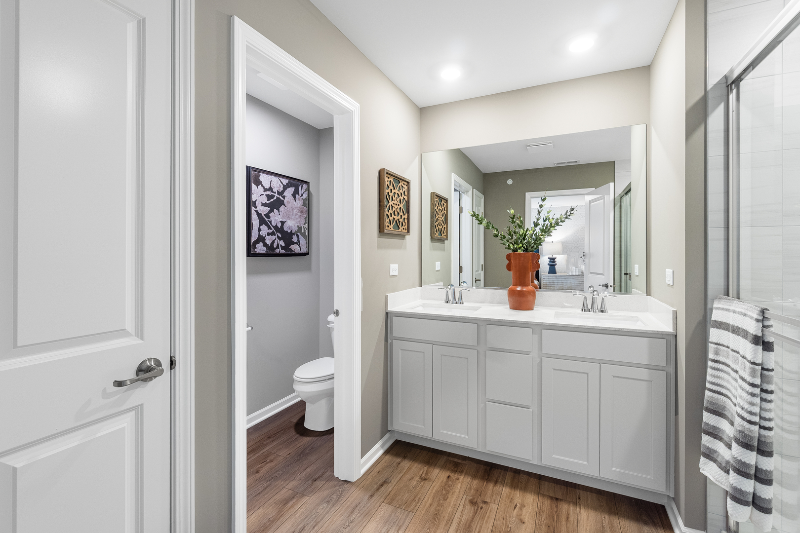 2246 Stonegate Road Algonquin, IL 60102 - Photo 13 of 20 a spacious bathroom with a double vanity sink a toilet and a mirror
