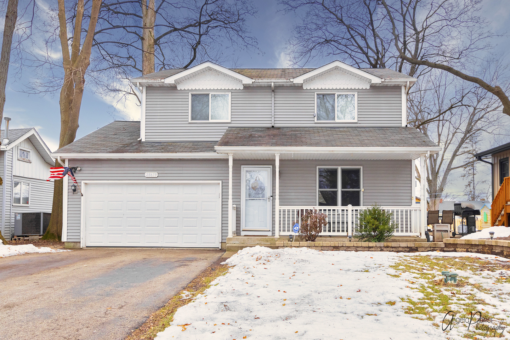 28659 West High Road Ingleside, IL 60041 - Photo 1 of 29 a front view of a house with a yard and garage