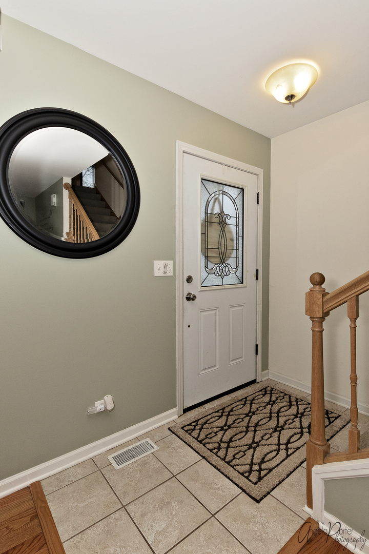 28659 West High Road Ingleside, IL 60041 - Photo 2 of 29 a view of a livingroom with furniture and mirror