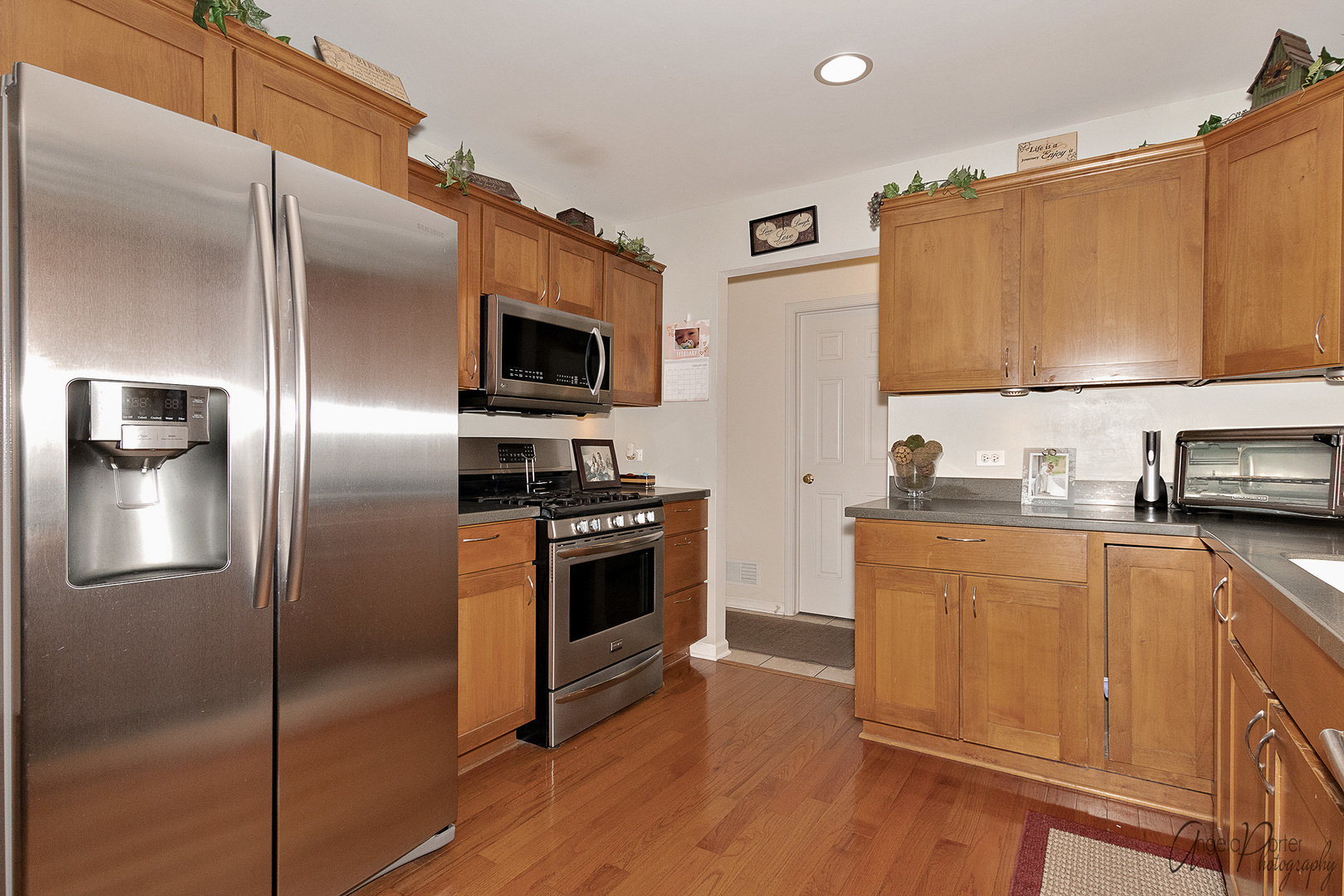 28659 West High Road Ingleside, IL 60041 - Photo 14 of 29 a kitchen with stainless steel appliances granite countertop a refrigerator stove and sink