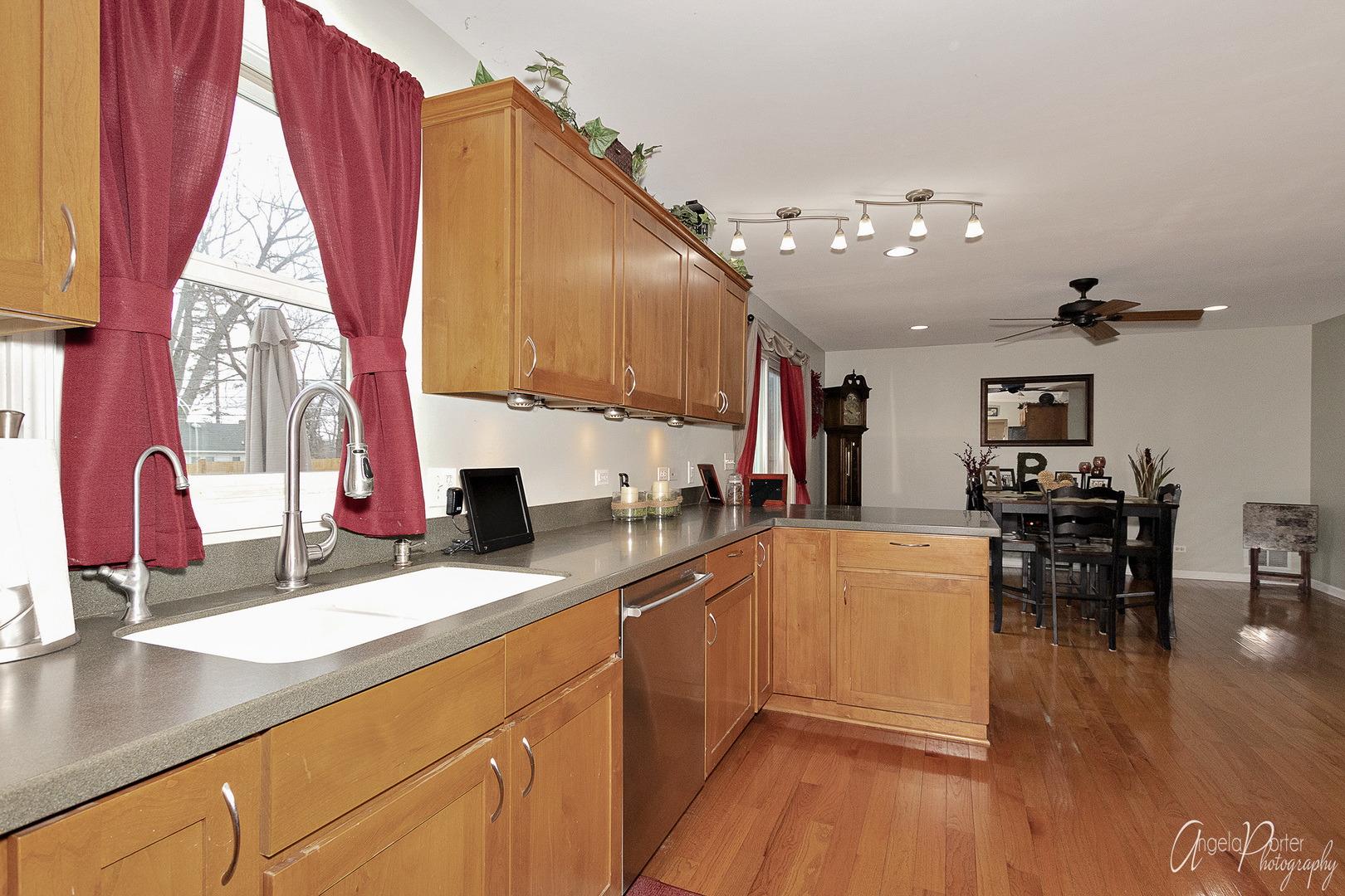 28659 West High Road Ingleside, IL 60041 - Photo 15 of 29 a kitchen with stainless steel appliances kitchen island granite countertop a refrigerator a sink dishwasher a dining table and chairs with wooden floor