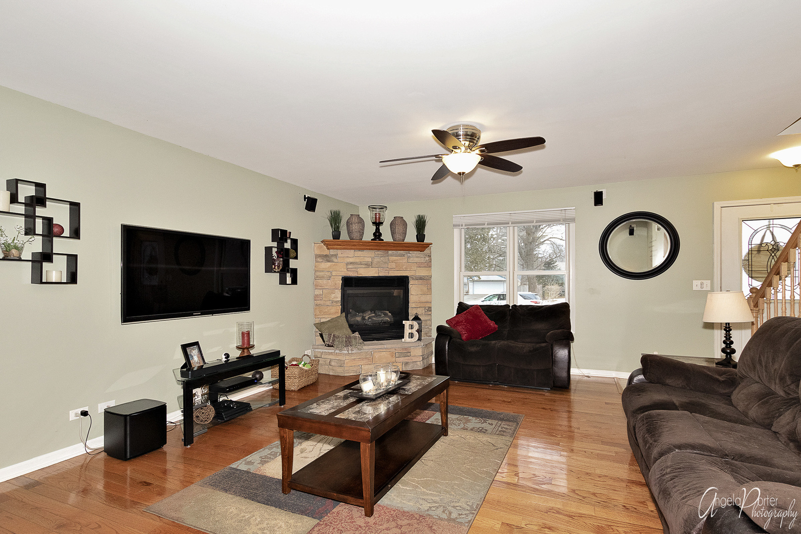 28659 West High Road Ingleside, IL 60041 - Photo 4 of 29 a living room with furniture a flat screen tv and a large window