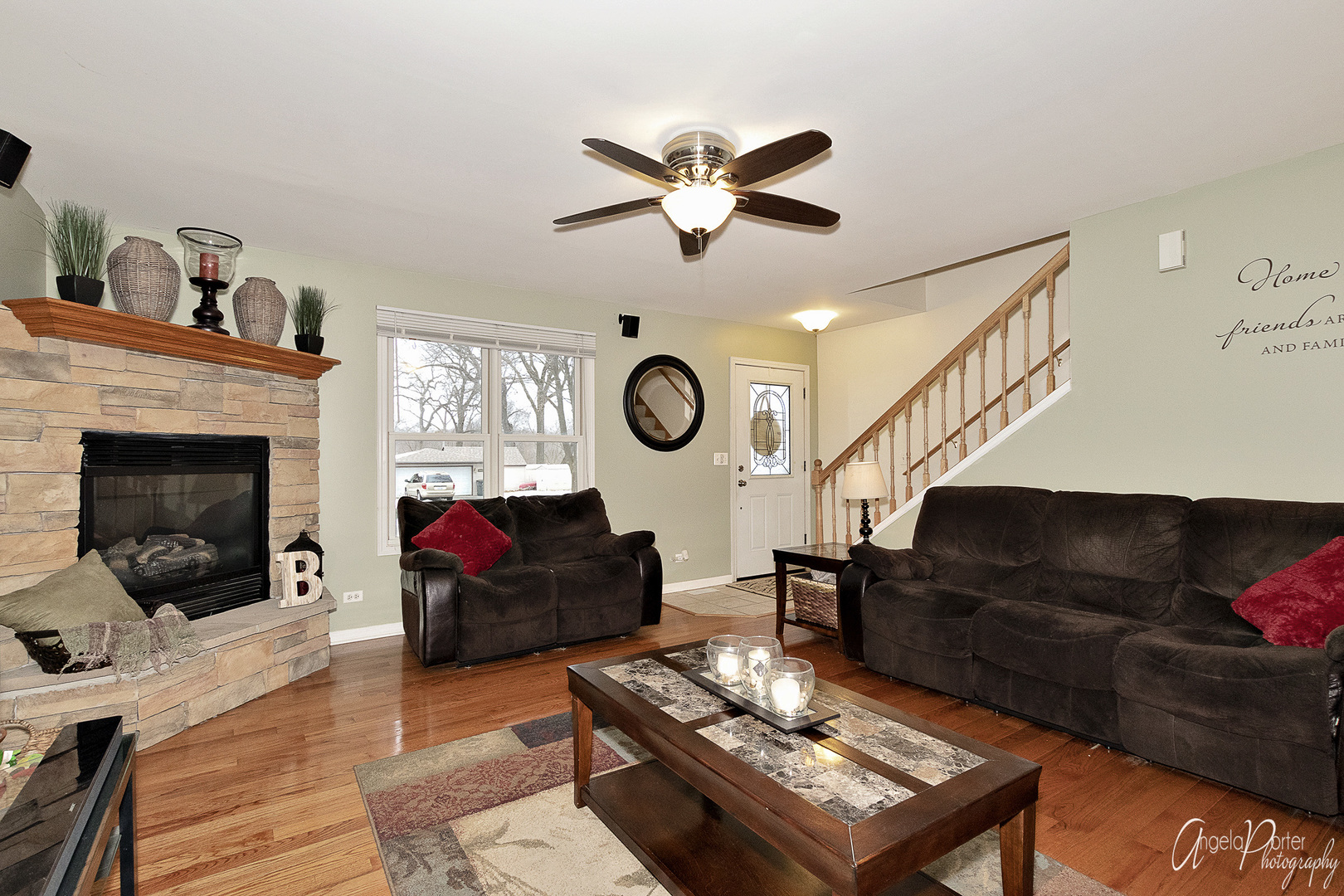 28659 West High Road Ingleside, IL 60041 - Photo 5 of 29 a living room with furniture a rug and a fireplace