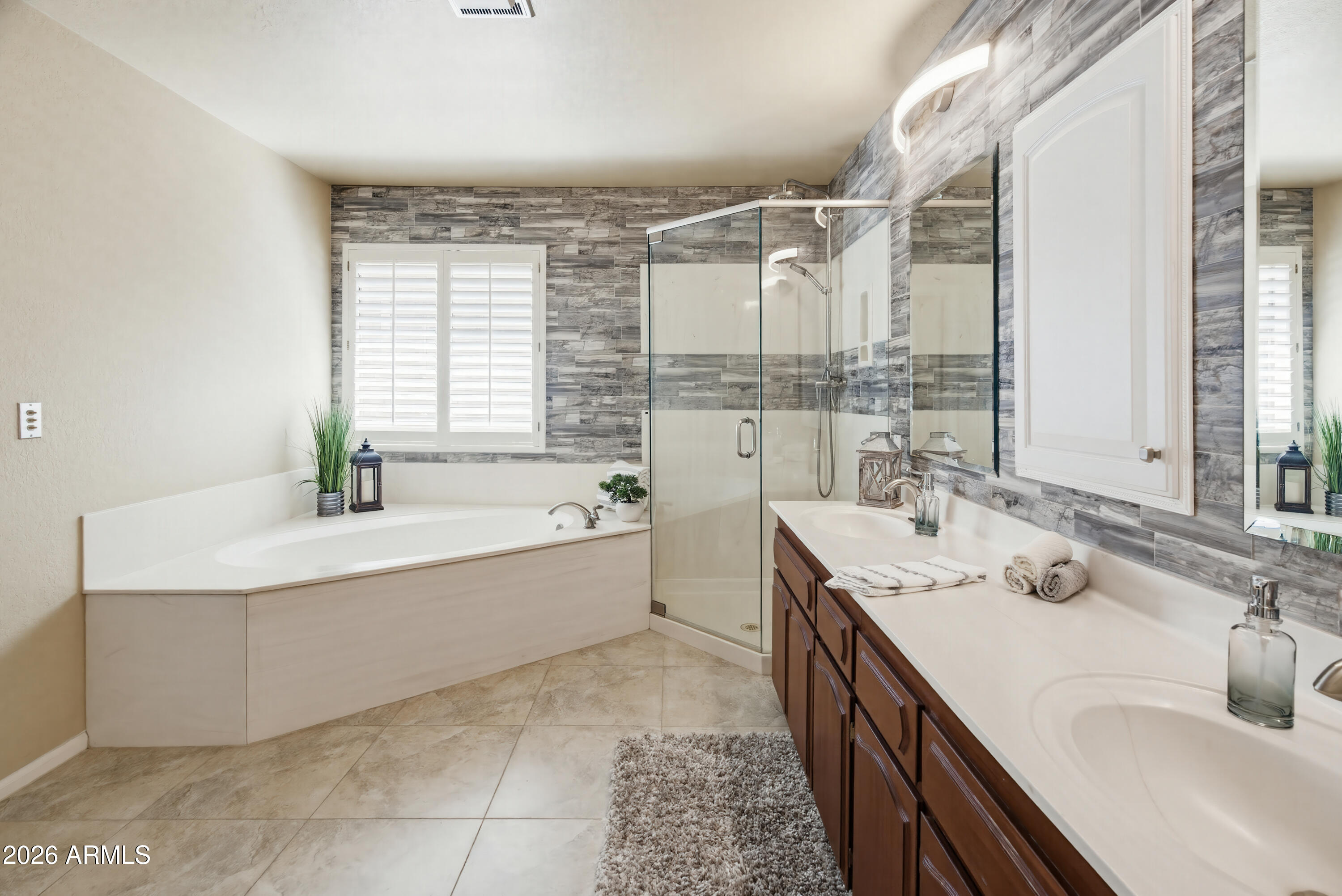 841 North Gentry Mesa, AZ 85213 - Photo 27 of 74 a bathroom with a double vanity sink mirror and a bathtub