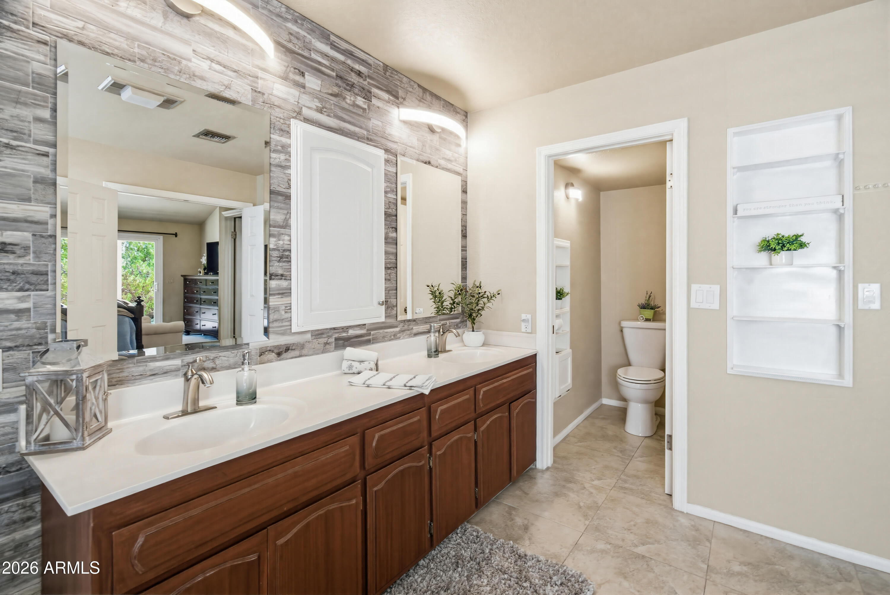 841 North Gentry Mesa, AZ 85213 - Photo 28 of 74 a spacious bathroom with a double vanity sink a toilet and a mirror