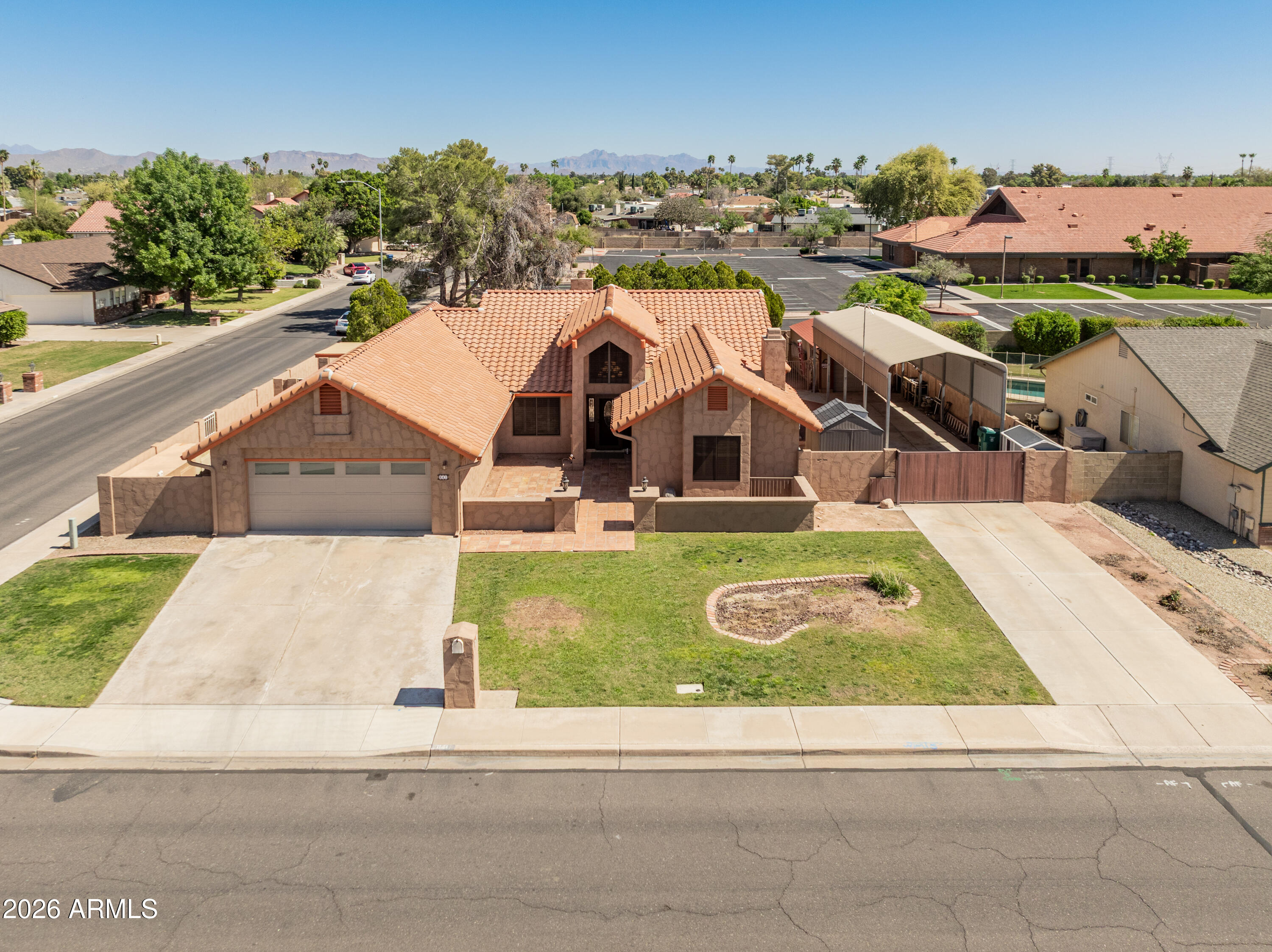 841 North Gentry Mesa, AZ 85213 - Photo 2 of 74 an aerial view of a house with garden space and ocean view