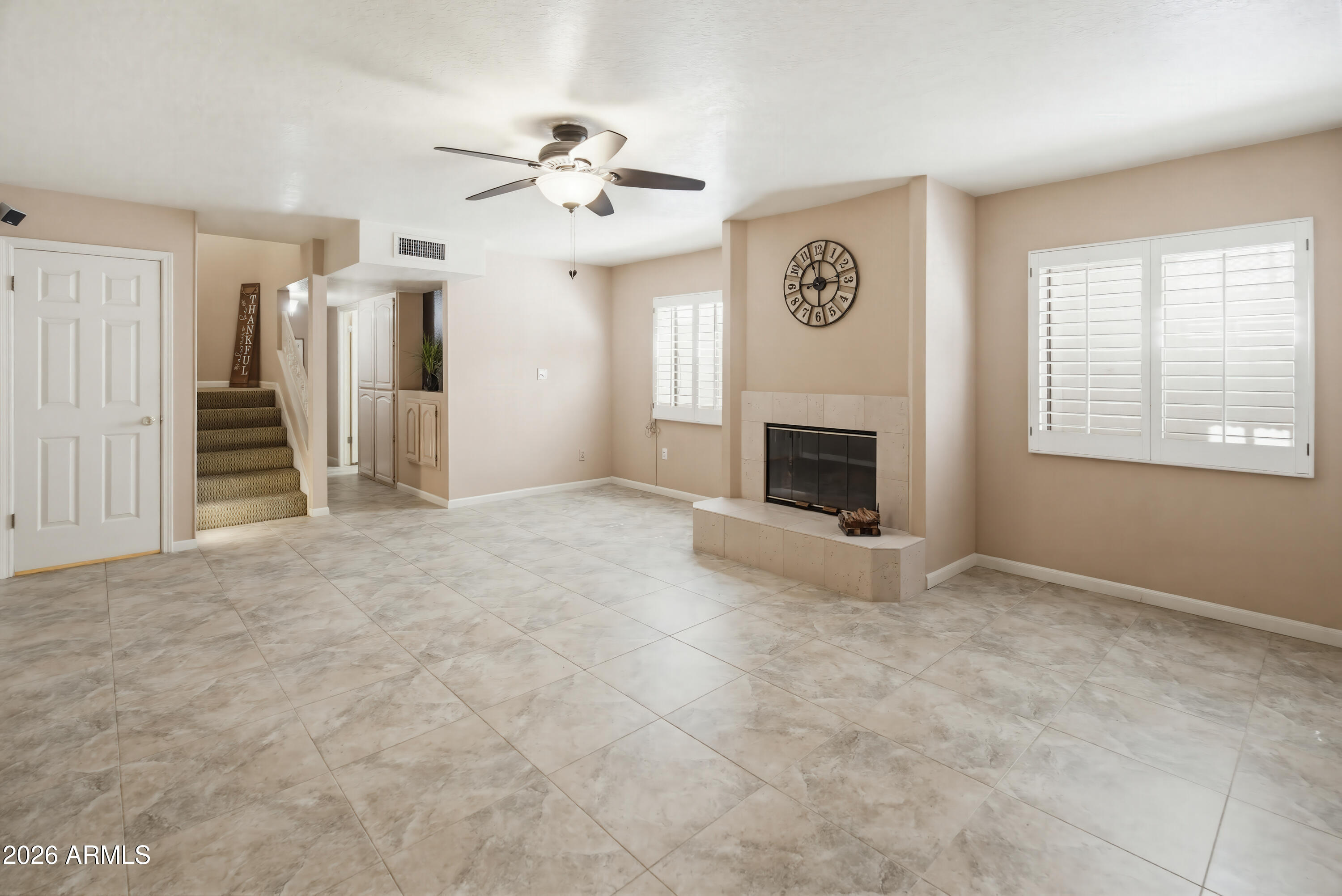841 North Gentry Mesa, AZ 85213 - Photo 39 of 74 an empty room with windows fireplace and fans