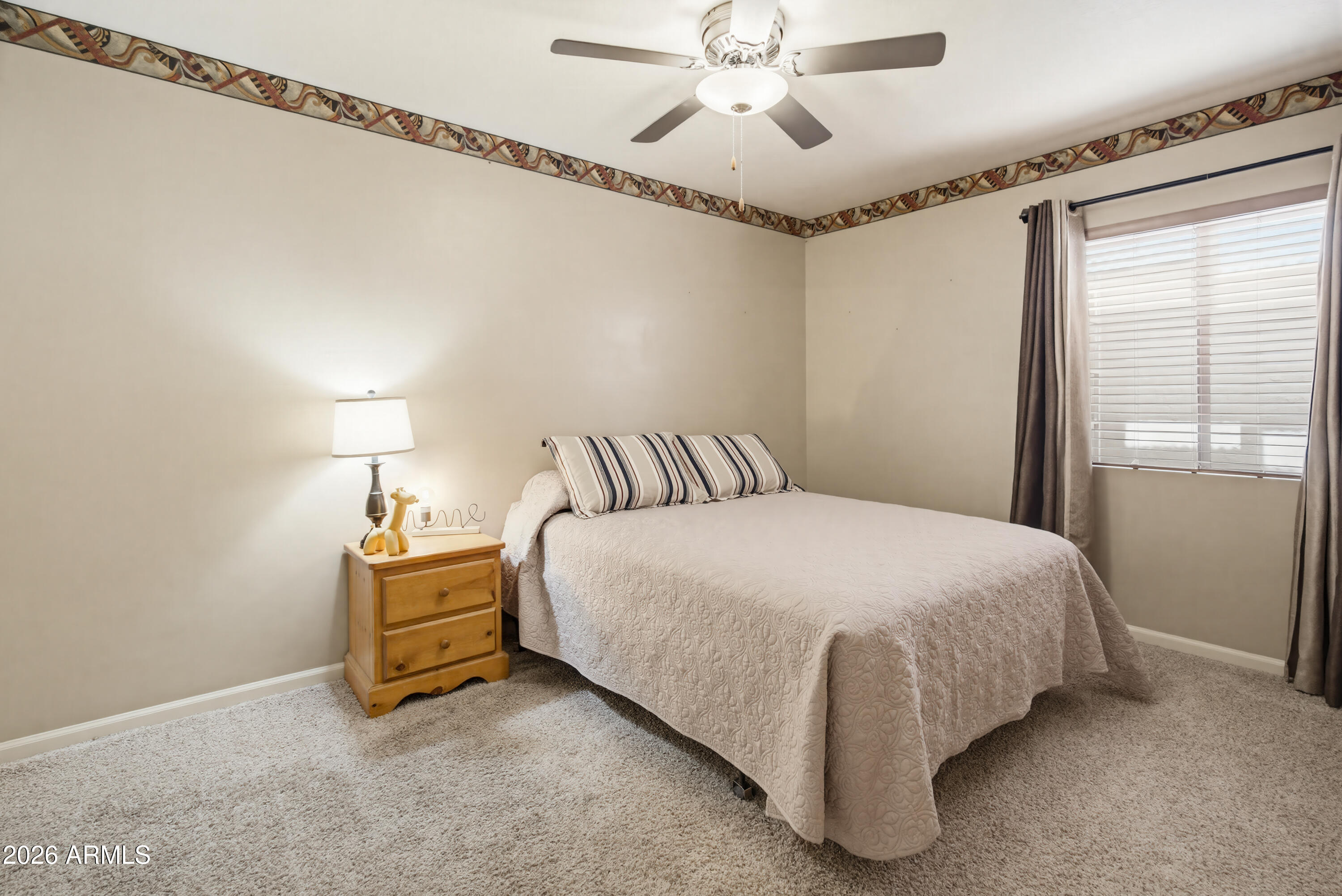 841 North Gentry Mesa, AZ 85213 - Photo 41 of 74 a spacious bedroom with a bed and window